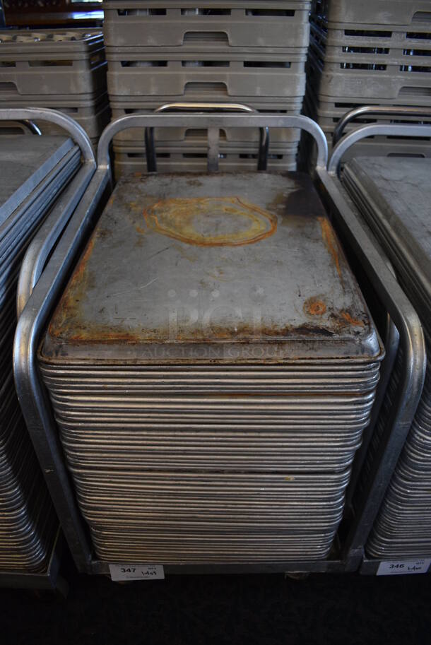 Metal Commercial Baking Pan Cart w/ Push Handle and 53 Full Size Metal Baking Pans on Commercial Casters. 27x21x33. 18x26x1. (back dining room) - Image 1 of 4