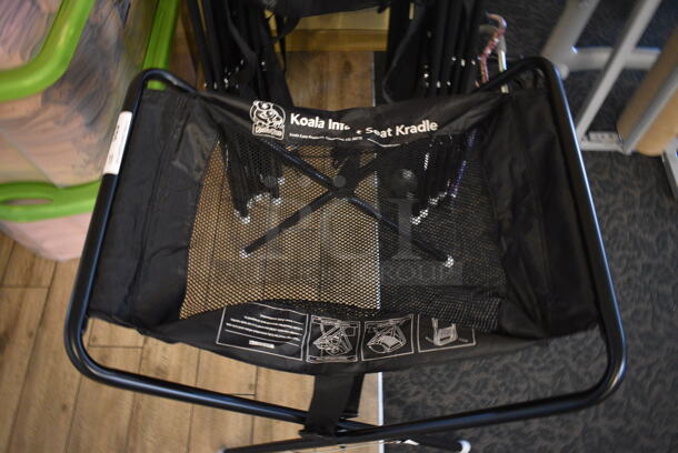 12 Koala Kare Black Metal Car Seat Kradles. 20x25x30. 12 Times Your Bid! (main dining room) - Image 2 of 3