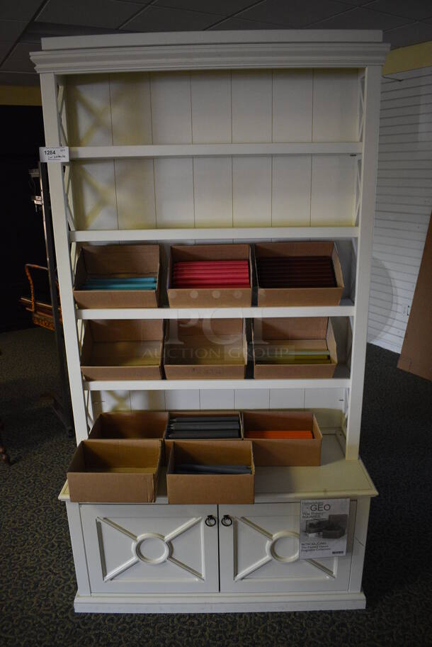 White Wooden Hutch w/ Candle Sticks. 46x19x82. (yellow clothing store)