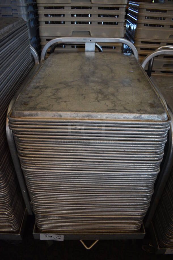 Metal Commercial Baking Pan Cart w/ Push Handle and 60 Full Size Metal Baking Pans on Commercial Casters. 29x21x33.5. 18x26x1. (back dining room) - Image 1 of 4