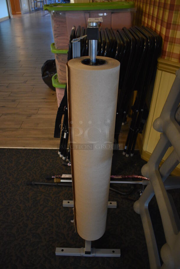 Uline Gray Metal Floor Style Rack w/ Brown Paper Roll. 14x14x44. (main dining room) - Image 1 of 3