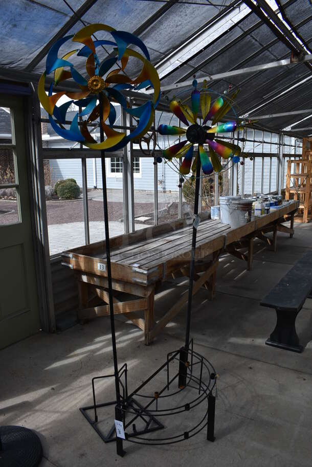 Black Metal Floor Style Rack w/ 2 Colorful Pinwheels. 24x12x84, 23x9x77. (greenhouse) - Image 1 of 5