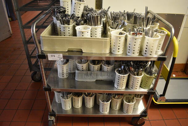 Stainless Steel Commercial 3 Tier Cart w/ Push Handles and Various Silverware in White Baskets on Commercial Casters. 37x24x39.5.( kitchen)