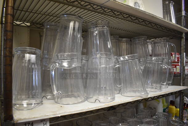 Metro Chrome Finish 4 Tier Shelving Unit w/ 118 Clear Poly Pitchers. BUYER MUST DISMANTLE. PCI CANNOT DISMANTLE FOR SHIPPING. PLEASE CONSIDER FREIGHT CHARGES. 48x18x74. 7.5 5.5 8.5 (kitchen) - Image 2 of 5