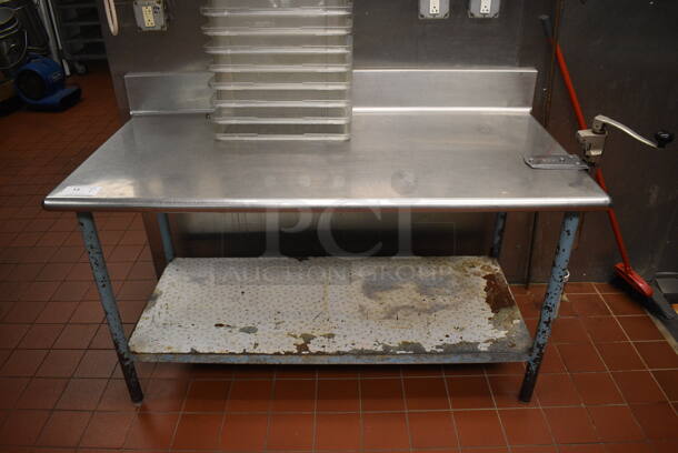 Stainless Steel Commercial Table w/ Mounted Commercial Can Opener, Back Splash and Metal Under Shelf. 60x30x39. (kitchen) - Image 1 of 5