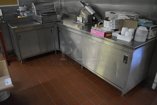 Stainless Steel Commercial L Shaped Table w/ 4 Doors and Under Shelves. Does Not Come w/ Contents. BUYER MUST REMOVE. 66x110x40.5. (bakery kitchen)