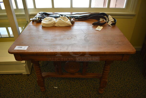 Wooden Table w/ Contents Including Belts. 40x40x30. (yellow clothing store)