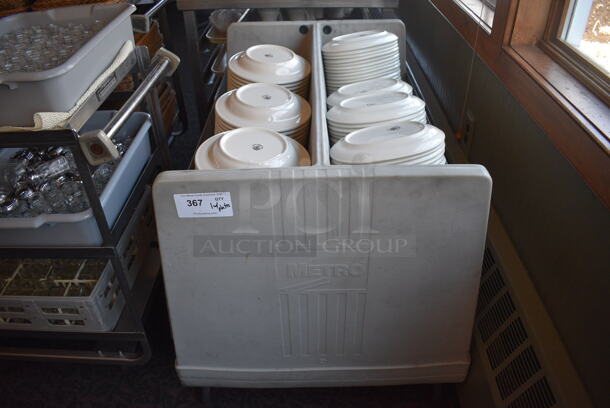 Metro Gray Poly Dish Cart w/ White Ceramic Plates on Commercial Casters. 39x29x31.5. 9.5x9.5x1.5. 10x7.5x1.5. (back dining room)