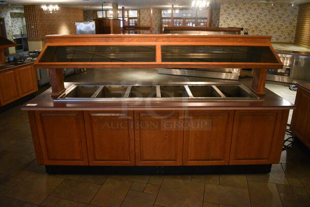 Portable Buffet Station w/ Hatco Model GRAHL-84D Heat Strip, Sneeze Guard and Wooden Exterior on Commercial Casters. 108x40x60.5. Unit Was In Working Condition When Restaurant Closed. BUYER MUST REMOVE. (buffet)
