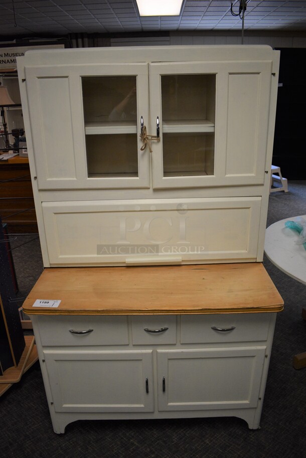 White Wooden Cabinet w/ 4 Doors and Drawer. 40x25x68. (garden center)