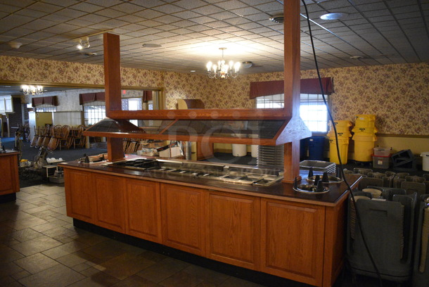 Portable Buffet Station w/ 4 Plate Return Chutes, Sneeze Guard and Wooden Exterior on Commercial Casters. 135x42x98. Unit Was In Working Condition When Restaurant Closed. BUYER MUST REMOVE. (buffet) - Image 2 of 8