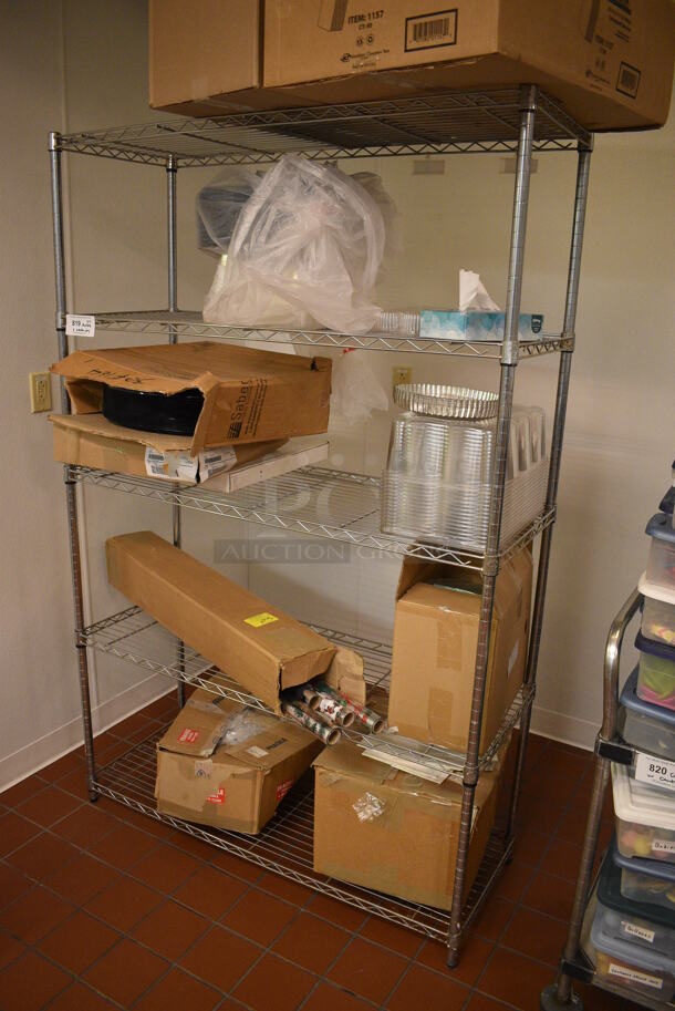 Chrome Finish 5 Tier Shelving Unit w/ Contents Including Wrapping Paper. BUYER MUST DISMANTLE. PCI CANNOT DISMANTLE FOR SHIPPING. PLEASE CONSIDER FREIGHT CHARGES. 48x18x74.5. (icing kitchen)