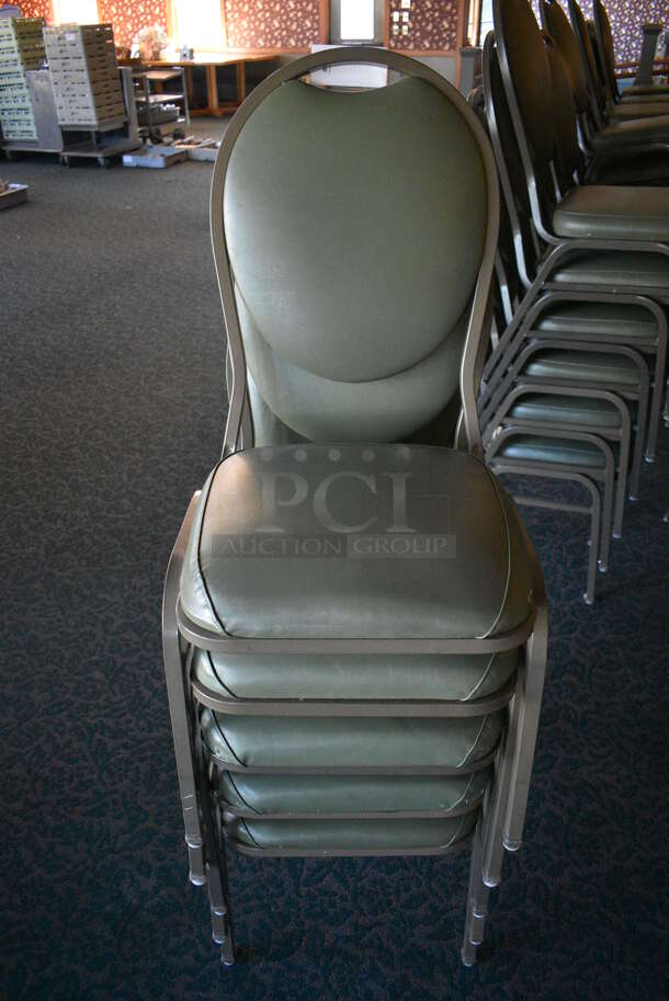 12 Green Stackable Banquet Chairs on Metal Frame. Stock Picture - Cosmetic Condition May Vary. 18x19x36. 12 Times Your Bid! (back dining room)