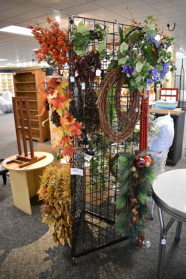 Black Metal Rack w/ Fake Plants on Commercial Casters. 25x25x77. (garden center)