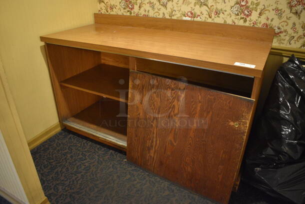 Wooden Counter w/ Under Shelves and 1 Door. 64x26.5x40. (main dining room)