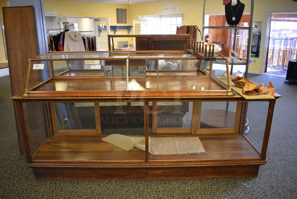 Glass Merchandising Case w/ Small Top Case. BUYER MUST REMOVE. 75x27x13, 96x26x35.5. (yellow clothing store) - Image 1 of 4