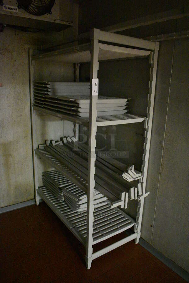Poly Gray 4 Tier Shelving Unit w/ Extra Pieces. BUYER MUST DISMANTLE. PCI CANNOT DISMANTLE FOR SHIPPING. PLEASE CONSIDER FREIGHT CHARGES. 48x24x72. (kitchen)