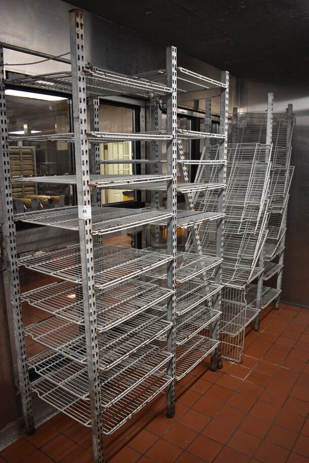 Metal 4 Section Multi Tier Shelving Unit. BUYER MUST DISMANTLE. PCI CANNOT DISMANTLE FOR SHIPPING. PLEASE CONSIDER FREIGHT CHARGES. Includes 49x24x80. (kitchen)