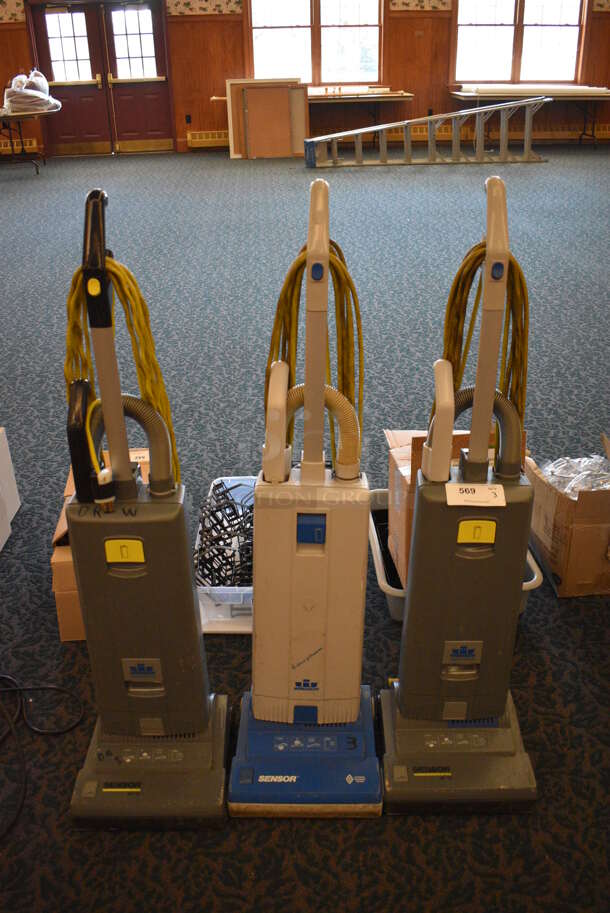 3 Various Windsor Commercial Vacuum Cleaners. Two Sensor XP12 and One Sensor. 12x12x46. 3 Times Your Bid! Unit Was In Working Condition When Restaurant Closed. (ballroom)
