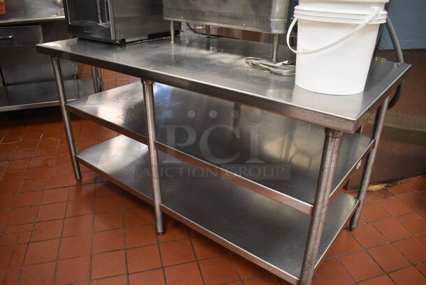 Stainless Steel Commercial Table w/ 2 Stainless Steel Under Shelves. Does Not Include Contents. 64x30x34. (kitchen)