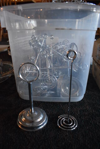 ALL ONE MONEY! Lot of Various Metal Countertop Table Number Holders in Clear Bin! Includes 2x2x7. 16.5x11x11. (main dining room)