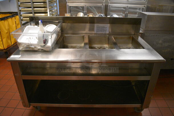 Stainless Steel Commercial Electric Powered 4 Bay Steam Table w/ Under Shelf and Bin of Various Paper Products on Commercial Casters. 64x36x46. Unit Was In Working Condition When Restaurant Closed. (kitchen) - Image 1 of 8