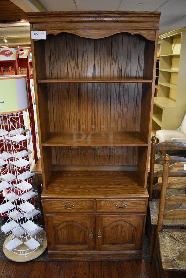 Wooden Cabinet w/ Drawer, 2 Doors and Shelves. 34x18x80.5. (gift shop)