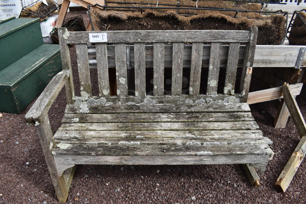 Wooden Bench. Missing Arm. 45x23x33. (greenhouse patio)