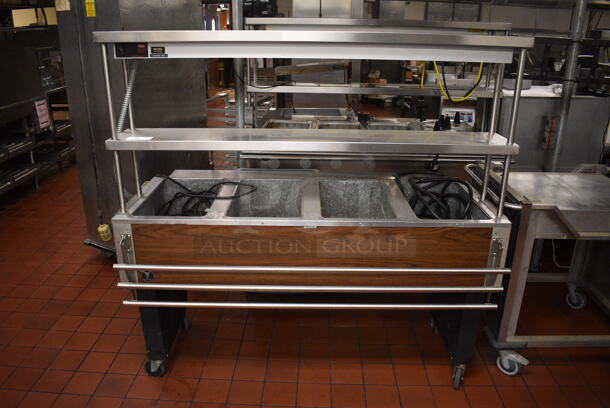 Eagle Stainless Steel Commercial Electric Powered 4 Bay Steam Table w/ Double Tier Over Shelf, Warming Strip and Tray Slide on Commercial Casters. 64x37x62. Unit Was In Working Condition When Restaurant Closed. (kitchen)