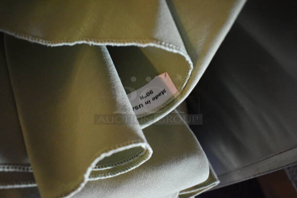 ALL ONE MONEY! Lot of Green and White Tablecloths in Gray Bin! 24x15x9. Includes 90x90 Round. (main dining room)  - Image 3 of 4