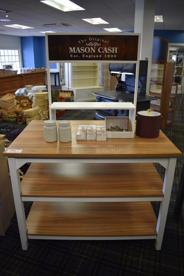 Wooden Table w/ Under Shelves and Contents. 48x31x67. (blue retail store)