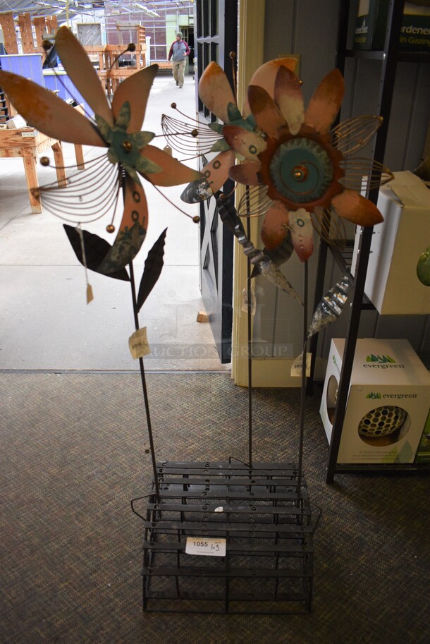 Black Metal Stand w/ 3 Wind Spinners. Includes 12x1x49. (garden center)