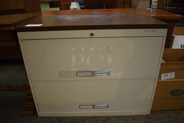 Metal Tan 2 Drawer Filing Cabinet w/ Wood Pattern Top. 36x18x29. (gift shop)