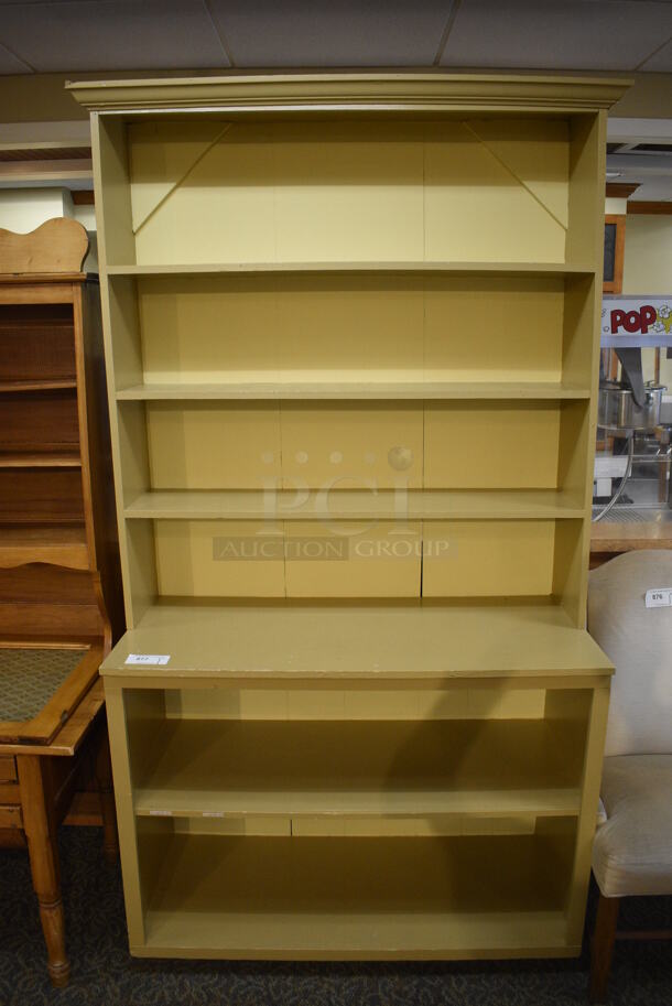 Yellow Wooden Cabinet w/ 2 Under Shelves and 3 Over Shelves. 48x21.5x90. (gift shop)
