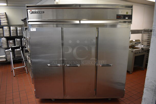 Victory Stainless Steel Commercial 3 Door Reach In Cooler w/ Poly Coated Racks on Commercial Casters. 78x36x82.5. Unit Was In Working Condition When Restaurant Closed. (drop in bin kitchen)