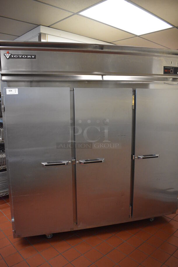 Victory Stainless Steel Commercial 3 Door Reach In Cooler w/ Poly Coated Racks on Commercial Casters. 78x36x82.5. Unit Was In Working Condition When Restaurant Closed. (drop in bin kitchen) - Image 2 of 8