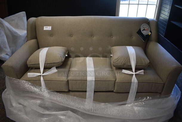 BRAND NEW! Lancer Gray Couch w/ 2 Pillows. 73x37x36. (garden center)