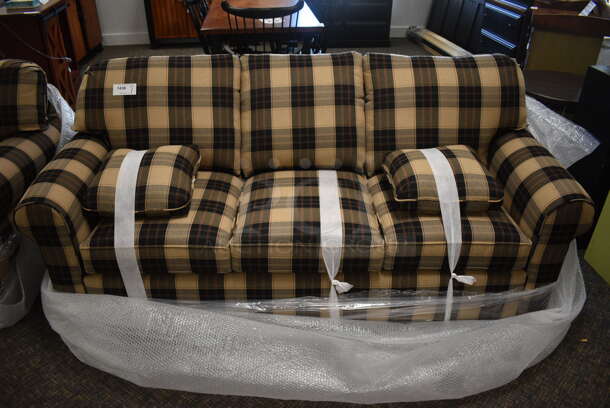 BRAND NEW! Lancer Tan and Black Patterned Plaid Couch w/ 2 Pillows. 84x35x37. (garden center)