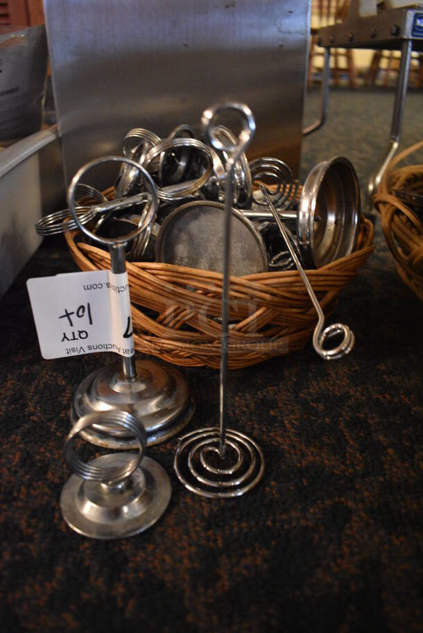 ALL ONE MONEY! Lot of Various Metal countertop Table Number Holders in Basket! Includes 3x3x6. (main dining room)