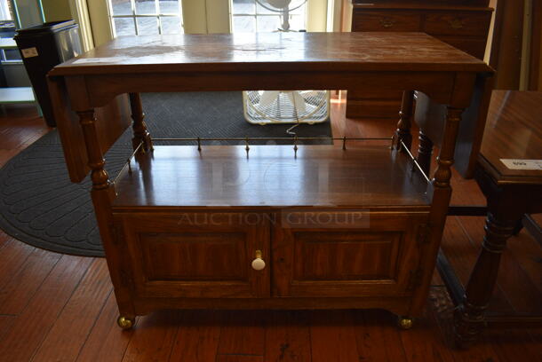 Wooden Table w/ 2 Doors and Under Shelf on Casters. 36x16x30. (gift shop)