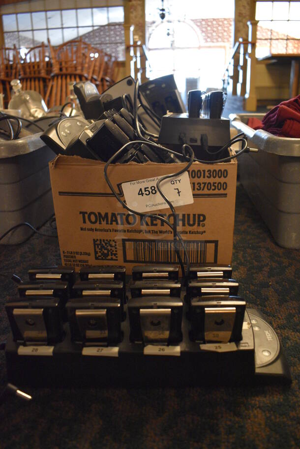 ALL ONE MONEY! Lot of 7 Jtech Table Beeper System Charging Bases w/ a Total of 55 Beepers. 5x13x2. (main dining room) - Image 1 of 8