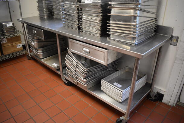 Stainless Steel Commercial Table w/ Back Splash, 2 Drawers and Under Shelf on Commercial Casters. Does Not Come w/ Contents. 96x30x40. (drop in bin kitchen)