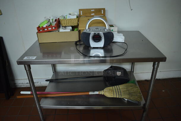 Stainless Steel Commercial Table w/ Contents Including Radio and Broom. 48x30x33.5. (bakery kitchen)
