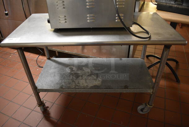 Stainless Steel Commercial Table w/ Metal Under Shelf on Commercial Casters. 48x24x33. (bakery kitchen)
