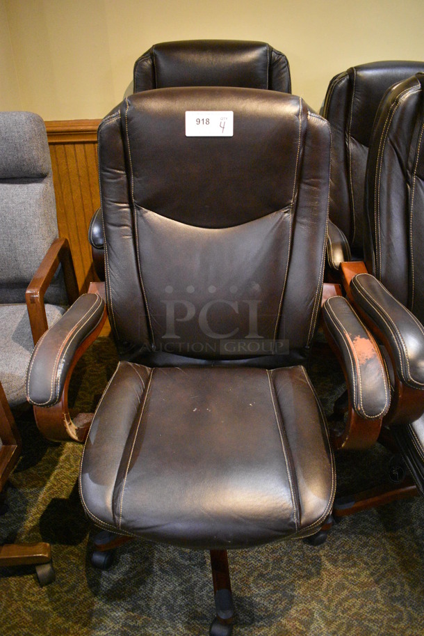 4 Office Chairs w/ Arm Rests on Casters. 27x22x46. 4 Times Your Bid! (gift shop)