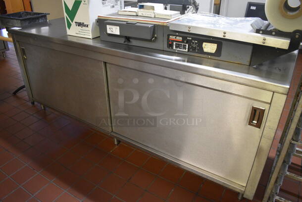 Stainless Steel Commercial Table w/ 2 Doors, Back Splash and Under Shelf. Does Not Include Contents. 90x27x40. (bakery kitchen) - Image 1 of 4