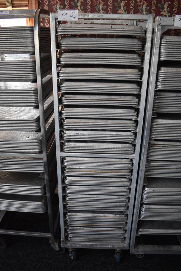 Metal Commercial Pan Transport Rack w/ 79 Metal Full Size Baking Pans on Commercial Casters. 20.5x26x68.5. 18x26x1. (sunroom dining room) - Image 1 of 5