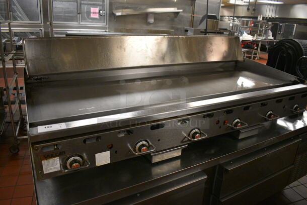 Vulcan Stainless Steel Commercial Countertop Natural Gas Powered Flat Top Griddle w/ Thermostatic Controls and Back Splash. 72x24x33. Unit Was In Working Condition When Restaurant Closed. (kitchen)