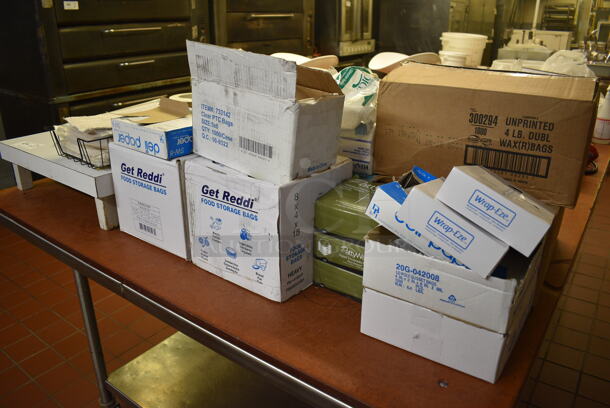 ALL ONE MONEY! Lot of Various Paper Products Including Hot Food Pads, White Countertop Dunnage Rack, Food Storage Bags, Patty Paper and Sandwich Wrap! (bakery kitchen) - Image 1 of 6