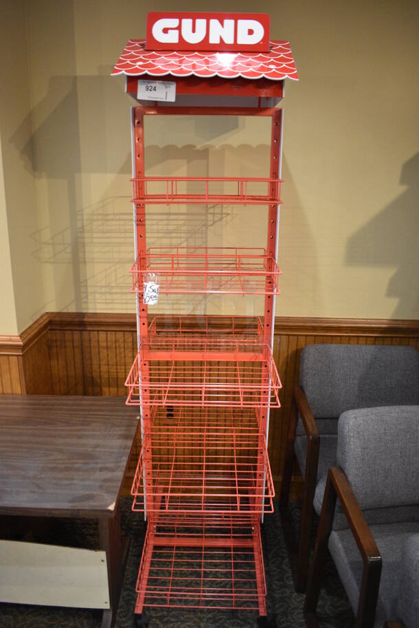 Red Metal Rack on Casters. 18x30x80. (gift shop)